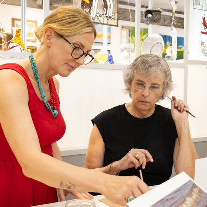 Artist, Crystal Beshara explaining the finer points of watercolour painting during a workshop at the PMAC Studio