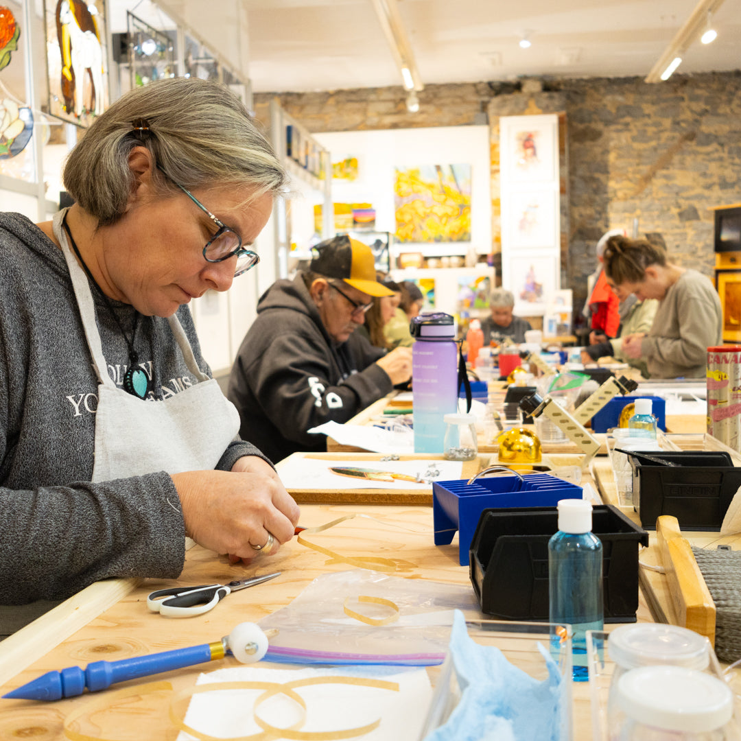 Guest foiling a stained-glass project in the PMAC Studio.