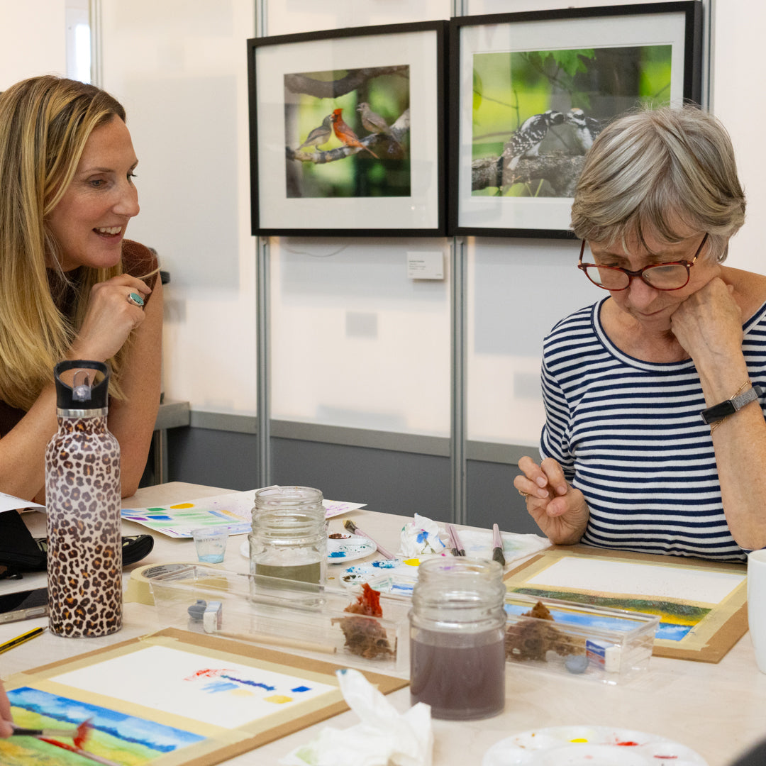 Artist, Crystal Beshara explaining the finer points of watercolour painting during a workshop at the PMAC Studio